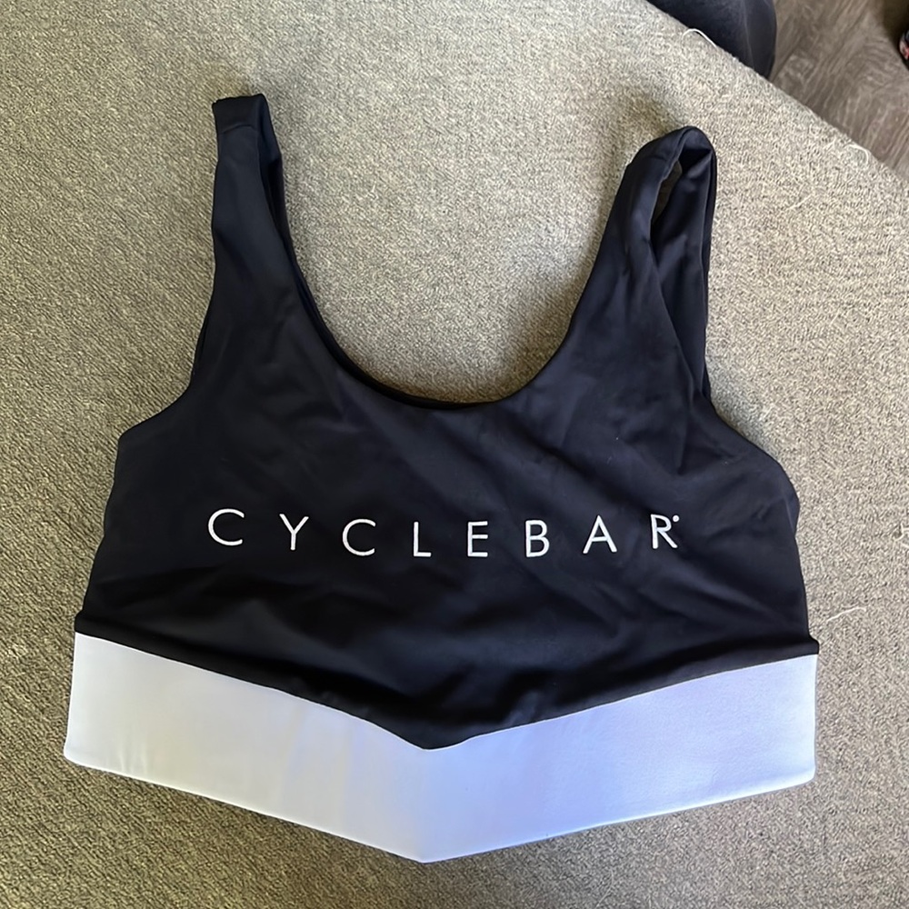 Black and white fits like a small. I wear a 32D. Very supportive to ride in.
